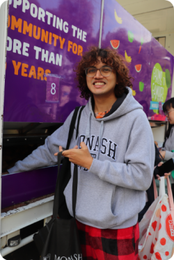 Monash University student at a Foodbank Farms to Families market