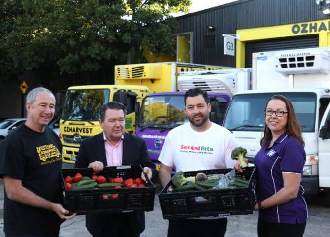 Oz Harvest, SecondBite, Foodbank, Senator Dean Smith holding boxes of fruit and vegetables