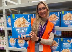 Thais holding a box of Wheat biscuits